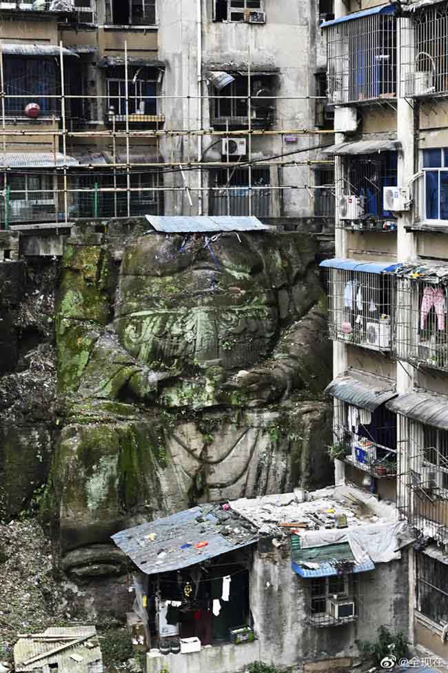 The huge headless ‘Buddha’ statue was discovered in a residential complex in Chongqing, southwest China. (Photo by Weibo user 