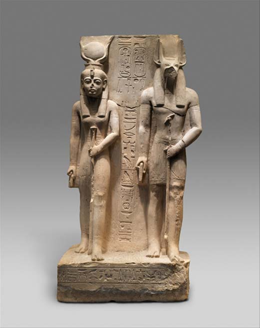 The Royal Scribe and Overseer of the Granaries, Siase, dedicated this limestone statue which represents Isis, his patron goddess, and Wepwawet, the local god of Asyut where the statue was made. Its fine but rather provincial style is the work of sculptors who were somewhat removed from the mainstream of the royal workshops. Reign of Ramesses II. Metropolitan Museum of Art, New York.