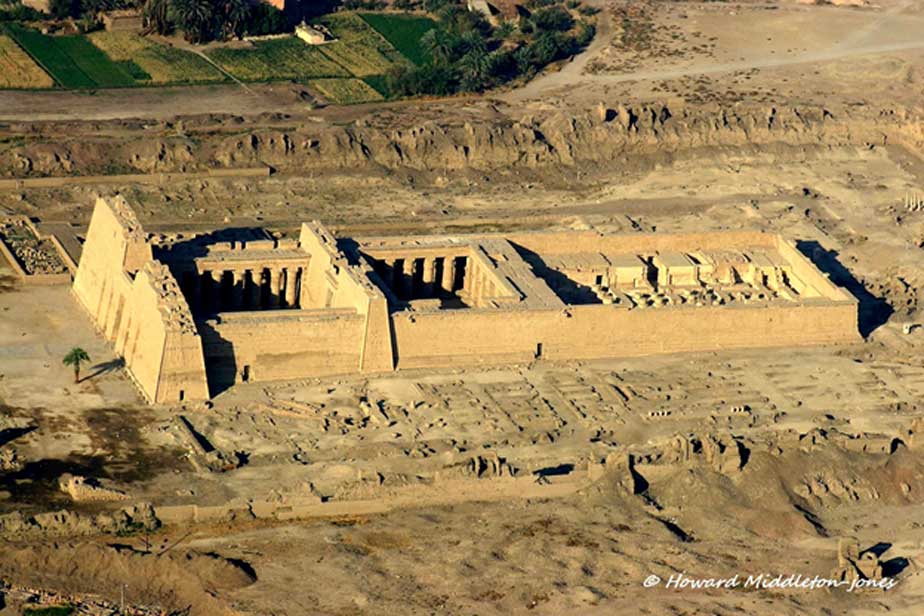 The imposing Mortuary Temple of Ramesses III at Medinet Habu. The pharaoh used this structure as his royal palace and later converted it into a war memorial in order to commemorate his victory over the Sea Peoples and Libyans. This image was shot during an aerial survey of the West Bank in 2010.