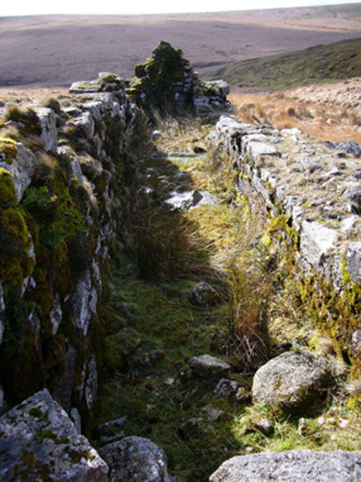 The remains of the wheelpit at Huntingdon mine on southern Dartmoor, where tin and cooper were mined. (Herbythyme / CC BY-SA 4.0)