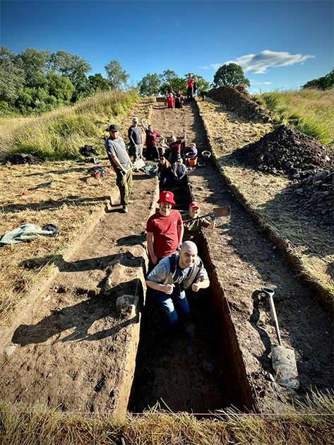 The Dig Ventures team along one long wall of the recently discovered medieval castle next to Soulton Hall in Shropshire, England. (Dig Ventures)