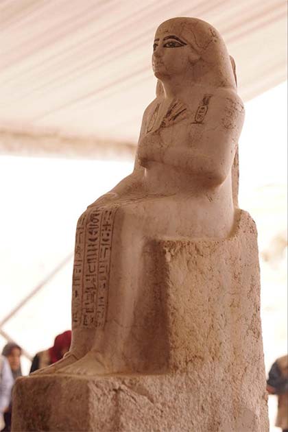 The alabaster statue of one tomb occupant is depicted wearing a long robe and sitting on a chair. (Ministry of Tourism and Antiquities)