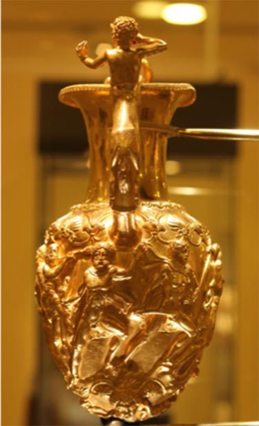 Shot of one of the scenes on the golden rhytonized amphora found with the Panagyurishte Treasure. The man with the trumpet can be seen on the left.  (stanimir.stoyanov / CC BY-NC 2.0)
