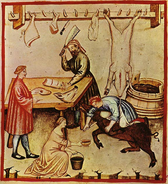 A 14th-century butcher shop. A large pig is being bled in preparation for slaughter. A whole pig carcass and cuts are hanging from a rack and various cuts are being prepared for a customer. (Public Domain)