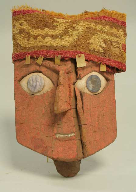 An almost cartoon-like funerary mask made with wood, gold, cloth and shell, 13th–15th century AD, Ica, Peru (Met Museum / Public Domain)