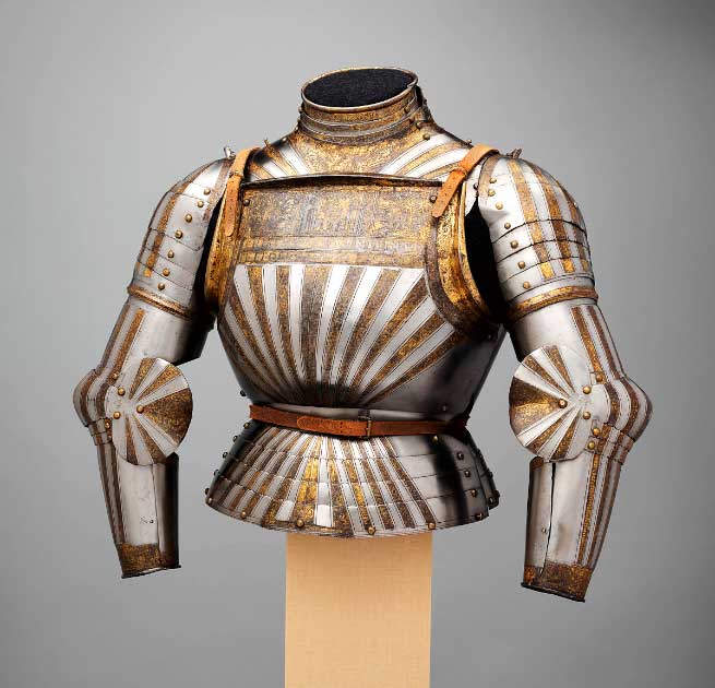 This is a rare example of Italian light-cavalry armor decorated with fluted surfaces in the German fashion, ca. 1510 AD. Its etched and richly gilt decoration is derived from Christian symbolism and the Bible. Weight: 19 lb. 13 oz. (8.98 kg). Source: The Metropolitan Museum of Art, Public Domain.