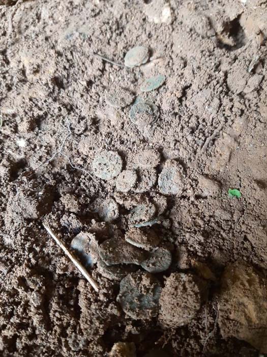 The Roman coin hoard before being excavated and removed from the Asturias cave. (Consejería de Cultura del Principado de Asturias)