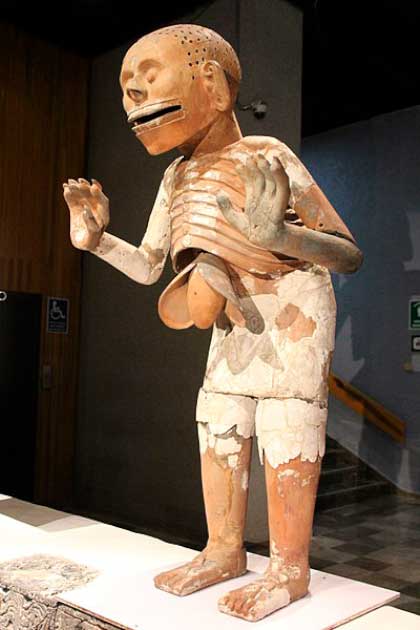 During excavations at the House of Eagles at the northern end of the Great Temple of Tenochtitlan in Mexico City, archaeologists uncovered two life-size clay statues of Mictlantecuhtli. These terrifying figures depicted the god of death and ruler of the underworld, shown with his liver hanging out, his skin ripped off, and claw-hands. Experts believed that worship of Mictlantecuhtli was linked to ritual cannibalism. (Gary Todd / CC BY SA 1.0)