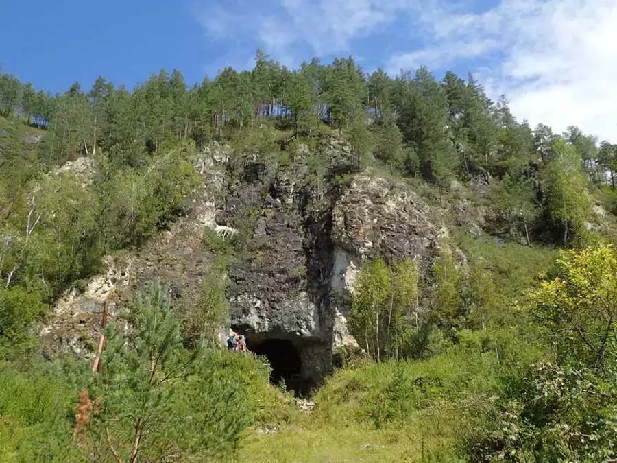 The entrance to the Denisova cave in the Altai Mountains of Siberia where the so-called new “Denisova Cave DNA” has proven, for the first time, the Neanderthals, Denisovans and Homo sapiens occupied the same cave at the same time sometimes!   Source: Professor Richard G. Roberts / University of Wollongong  By Ashley Cowie