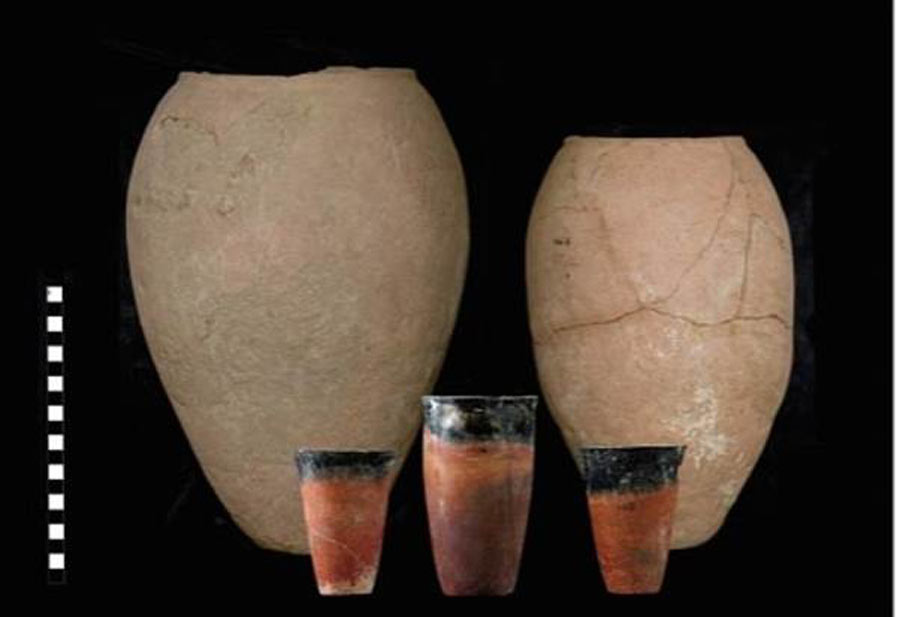 The complete large                                        straw-tempered Egyptian beer jars                                        from Hierakonpolis in the                                        background. The recent research                                        study suggests the contents of                                        these big jars would have been                                        decanted into smaller, finer                                        beakers, like the three shown in                                        this image. Source: Journal of                                        Anthropological Archaeology