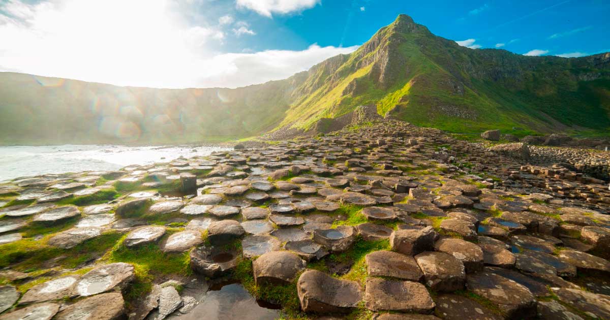 Visiting mythical places, like the Giant’s Causeway in Northern Ireland pictured, helps us connect with our past, as well as nature. Source: drimafilm / Adobe Stock 