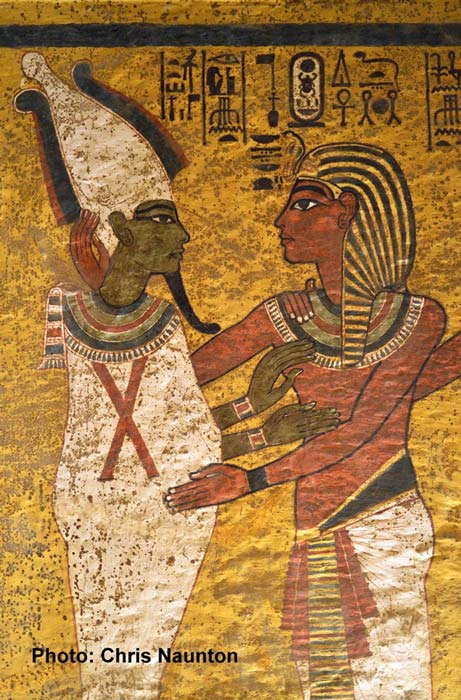 In the final scene on the north wall, Tutankhamun is shown wearing the nemes headcloth followed closely by his Ka (not in picture), as Osiris welcomes him into the Netherworld with an embrace.