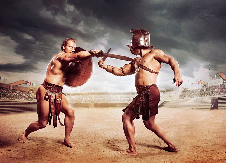 Gladiadores luchando en un anfiteatro. (Fotokvadrat/Adobe Stock)
