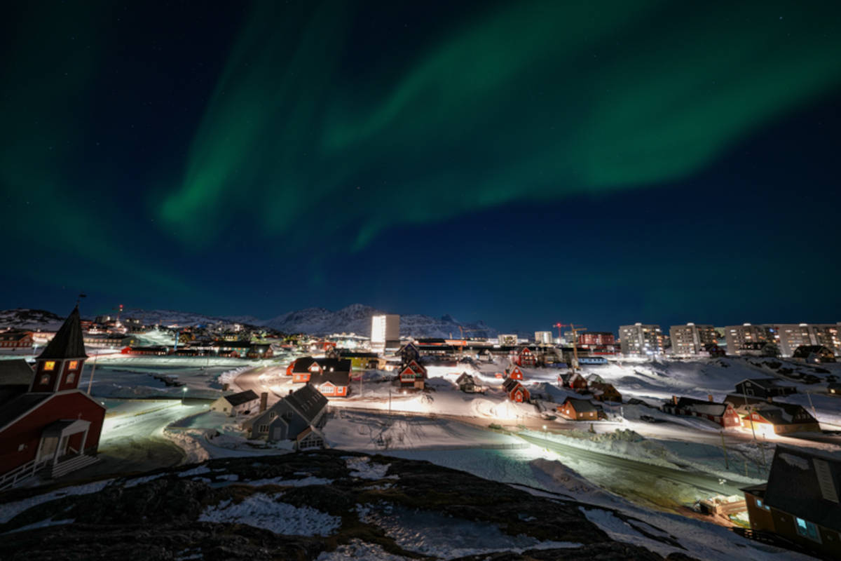 Northern lights shining over modern-day Greenland.