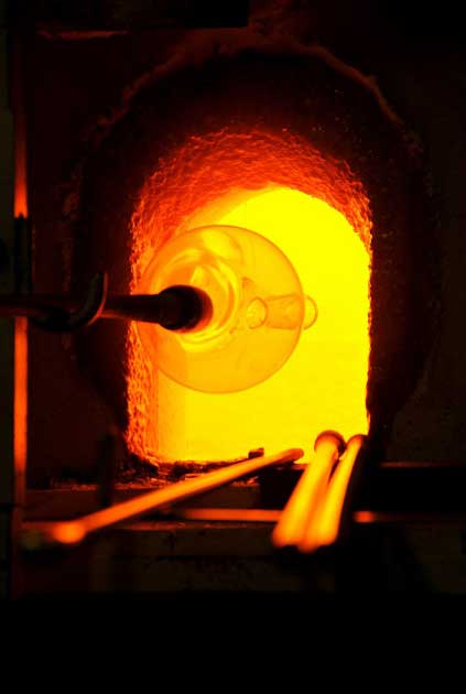 The history of glassblowing has been traced to Syrian craftsmen from Sidon and Babylon between 27 BC and 14 AD. This photo shows a Venetian glassblowing factory in action making a glass or perhaps a vase. (Dennis Jarvis / CC BY-SA 2.0)