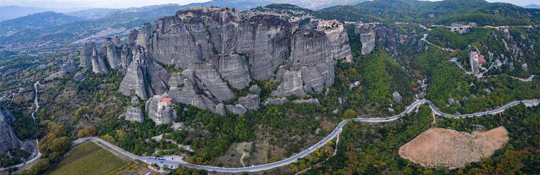 Aerial view of the landscape of Meteora with the monasteries perched on the cliffs (GDMpro S.R.O./ Adobe Stock)