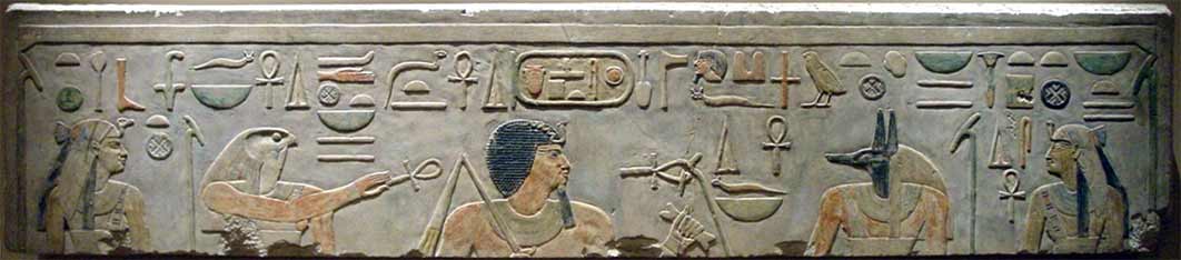 A raised-relief depiction of Amenemhat I accompanied by deities; the death of Amenemhat I is reported by his son Senusret I in the Story of Sinuhe. (John Campana/ CC BY-SA 2.0)
