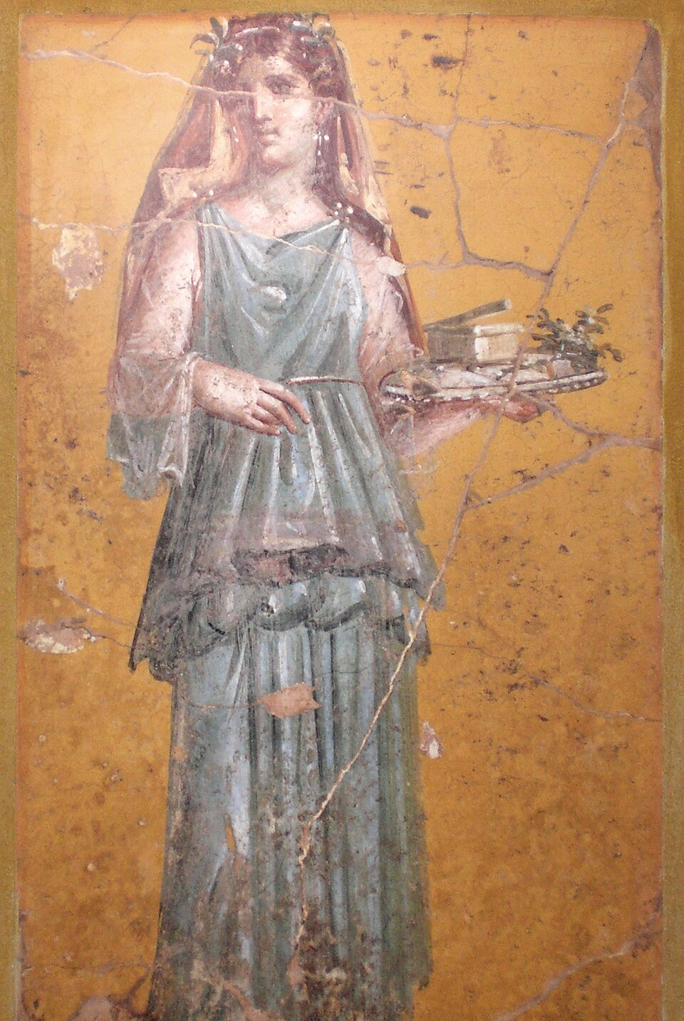 A Roman fresco from Pompeii depicting an elegantly dressed woman. Artistic images such as this provide insight into Roman ideals of beauty and fashion, including the popularity of light-colored hair among elite women.
