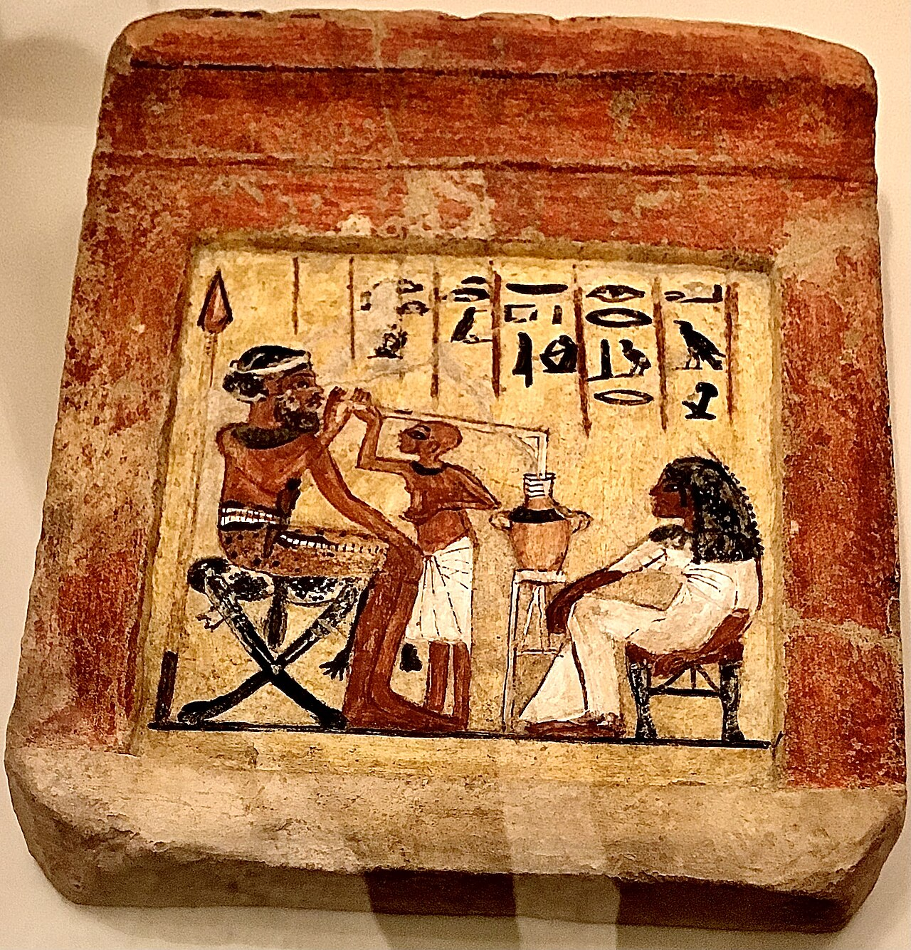 Ancient Egyptian Limestone Stela Depicting a Syrian Mercenary Drinking Beer through a Straw