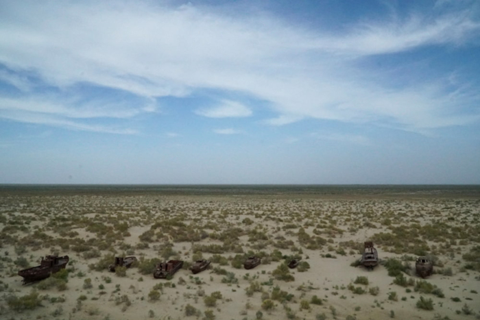 Rusted shipwrecks are stranded in the dried-up bed of the Aral Sea near Mo'ynoq