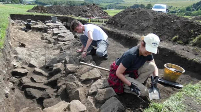 Volunteers excavating the Bremenium Fort site.