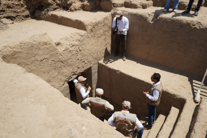 Officials at the entrance to the tomb.