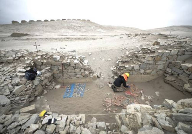 The news excavations with the 13 Towers ridge in the background.