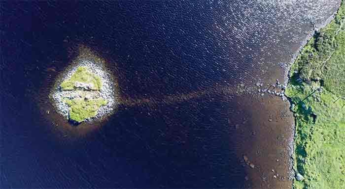 Aerial view of the Loch Bhorgastail crannog on the Isle of Lewis, Scotland