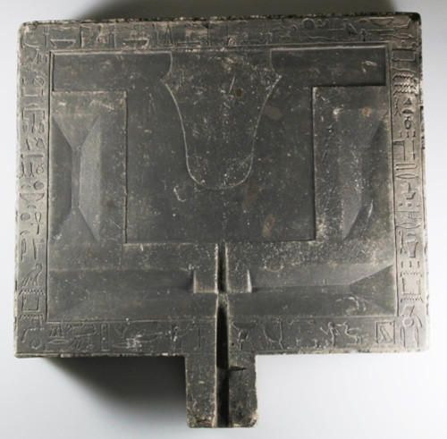 A rectanglualr offering table, with 4 basins for liquids, and a hetep and hieroglyphs.