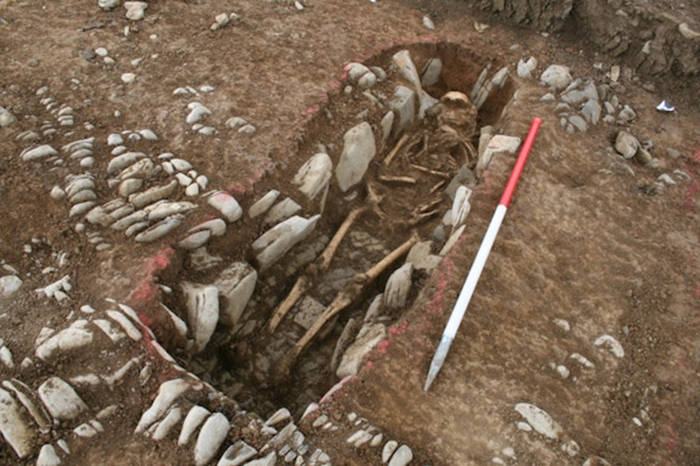 Skeleton found in stone-lined grave