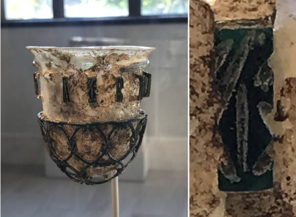 Roman glass openwork vessel with detail of its inscription