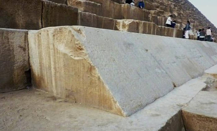 Base of the Great Pyramid of Khufu with the few remaining limestone blocks of the cladding.