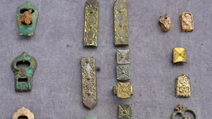 Decorated bronze and gilded belt fittings excavated from a Kimak-Kipchak burial