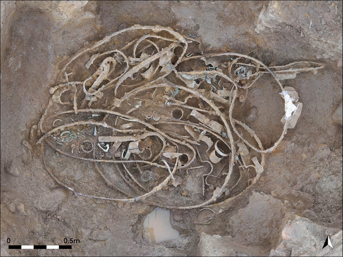 The bent iron tyres, hub elements and U-shaped iron brackets in Hoard 1
