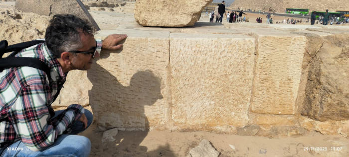 Author Armnado Mei examining stone blocks at the site.