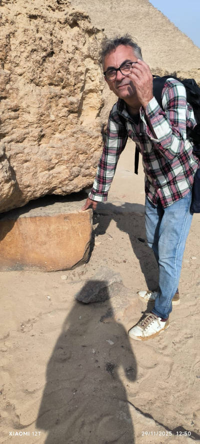 Author Armnado Mei examinign stone blcks at the site.