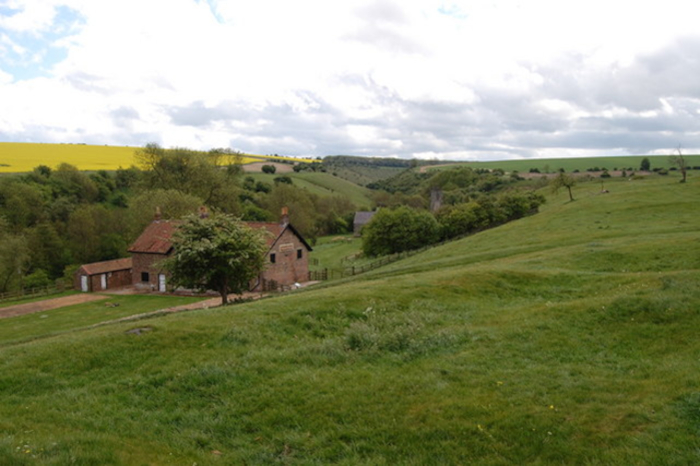 Wharram Percy deserted village with traceable house ruins visible in the terrain. 