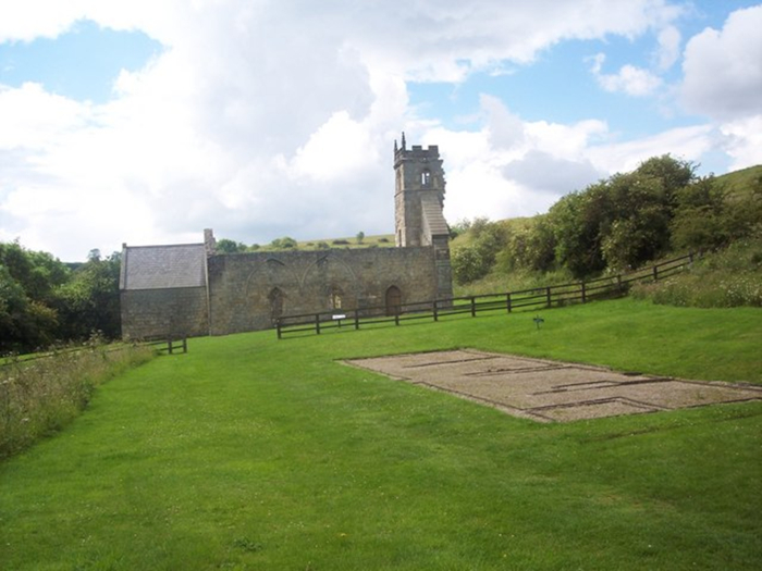 St Martin's Church and Rectory Excavations show the footprint of a house on the grass.