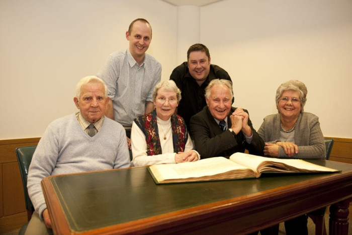 The Edwards family, descendants of the Pastons, gathered around the book containing the original letters.