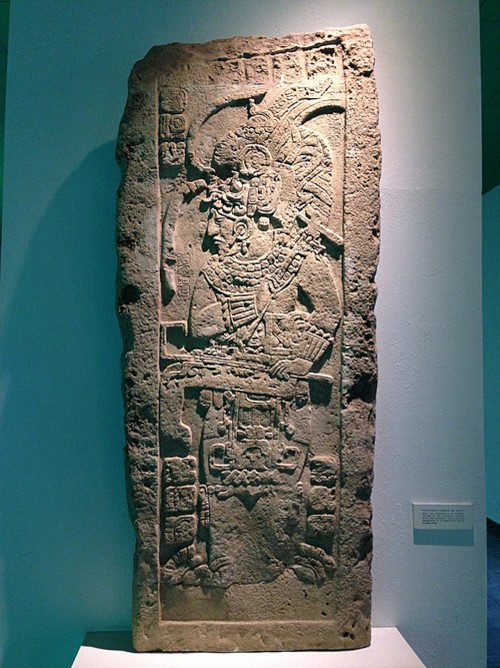 Maya stele depicting a priest wearing a ceremonial costume