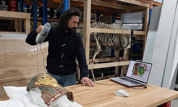 Archaeologist using handheld 3D scanners to noninvasively map objects 