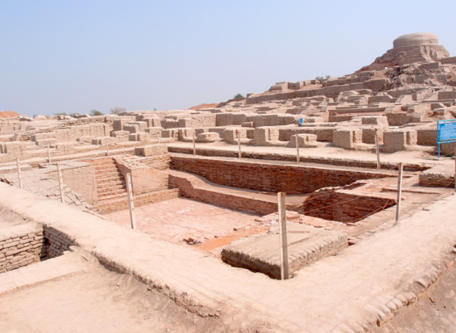 Excavated ruins of Mohenjo-daro, with the Great Bath in the foreground and the granary mound in the background. 