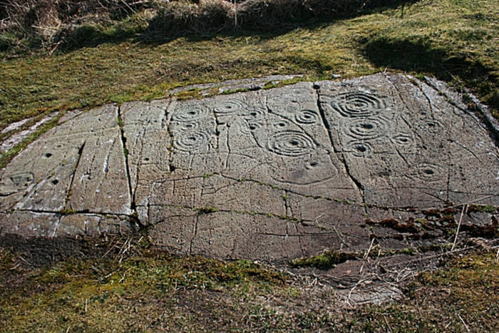 Cup and ring marked stone.