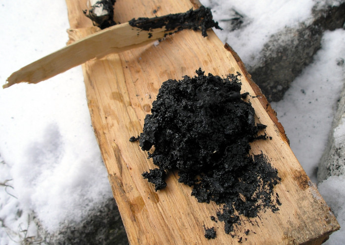 Birch bark pitch produced in a single sealed pot,