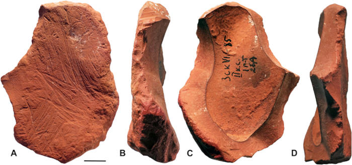 Four views of ochre fragment displaying multiple modifications