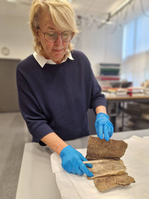 Consevator showing the book.