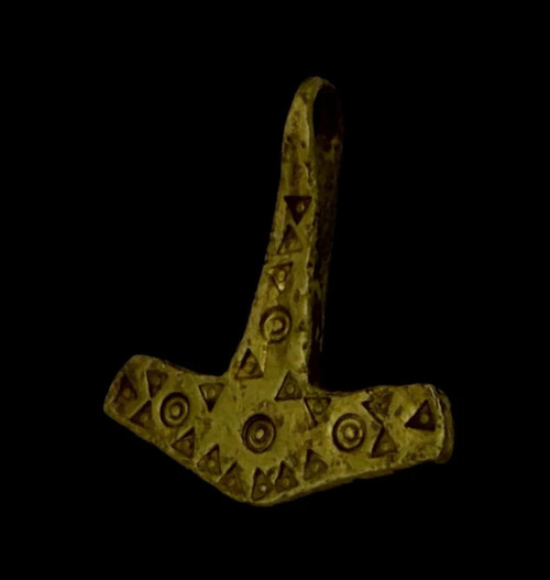 A high-status 11th-century silver filigree cross pendant, 