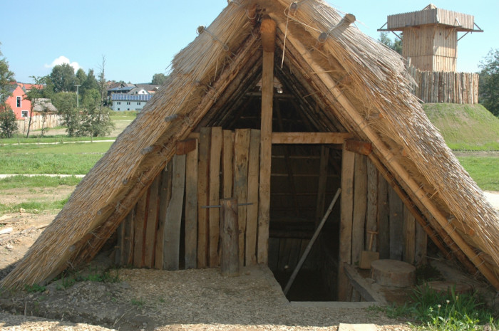 A reconstruction of an early medieval sunken-floored pit house.