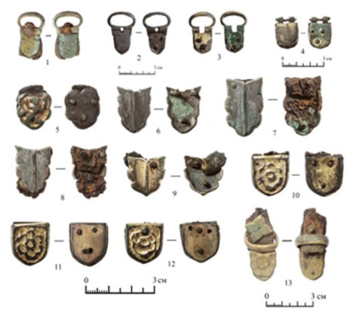 Harness decorations and buckles deposited at the site.