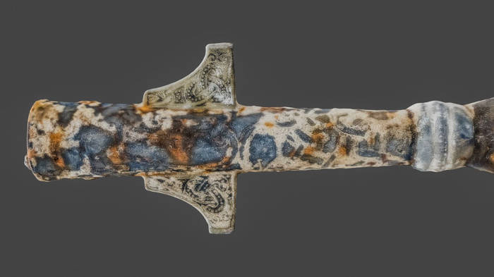 Close up of the elaborately decorated spear.